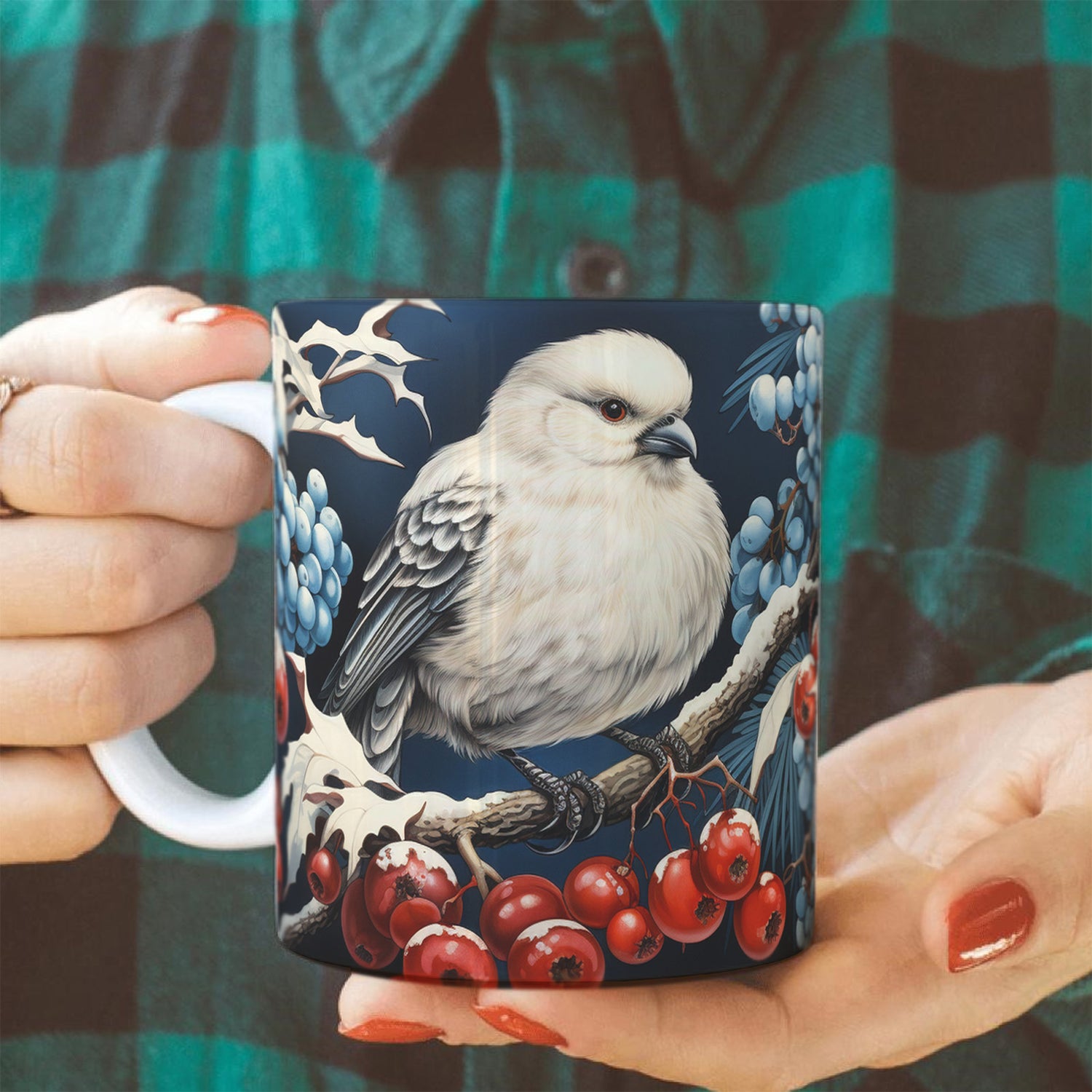 woman holding a mug with a bird and berry design against a plaid background