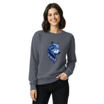 Woman wearing a gray sweatshirt with a blue wolf design on a white background