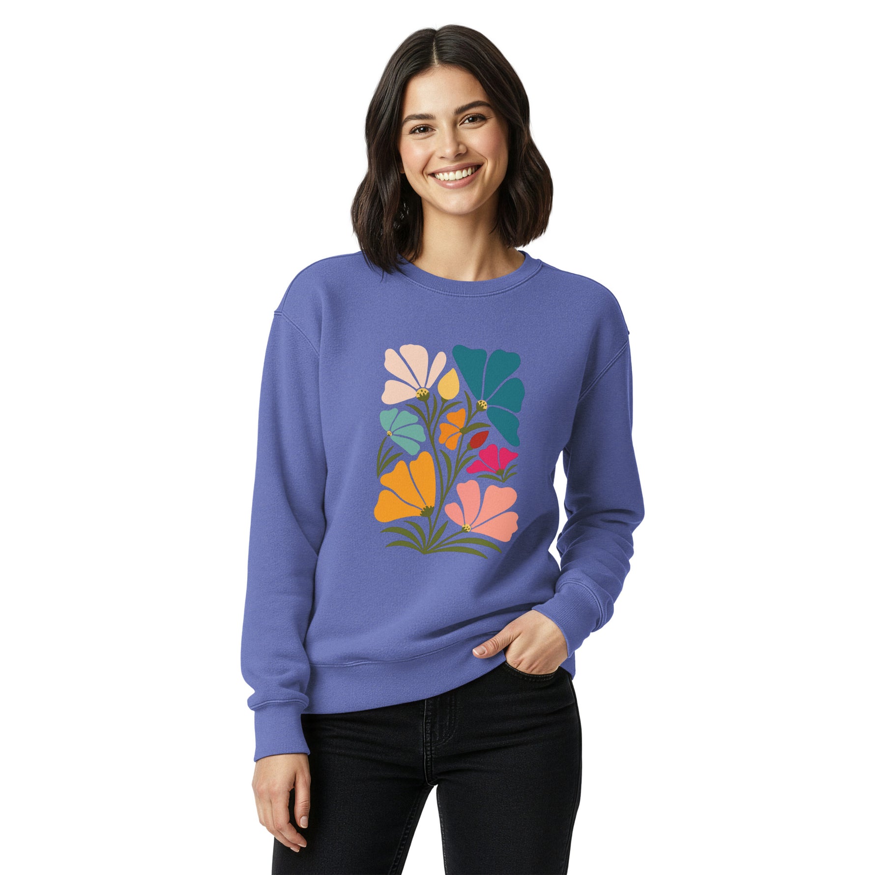 Woman wearing a blue sweatshirt with a colorful floral design on a white background