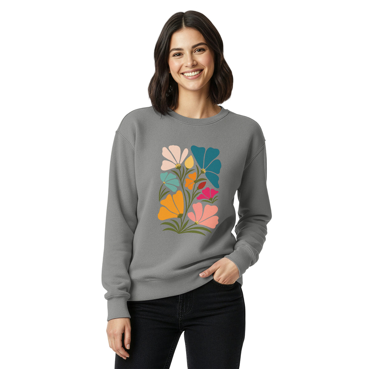 Woman wearing a gray sweatshirt with a colorful floral design on a white background