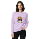Woman wearing a Comfort Colors light purple sweatshirt with a colorful skull design on a white background