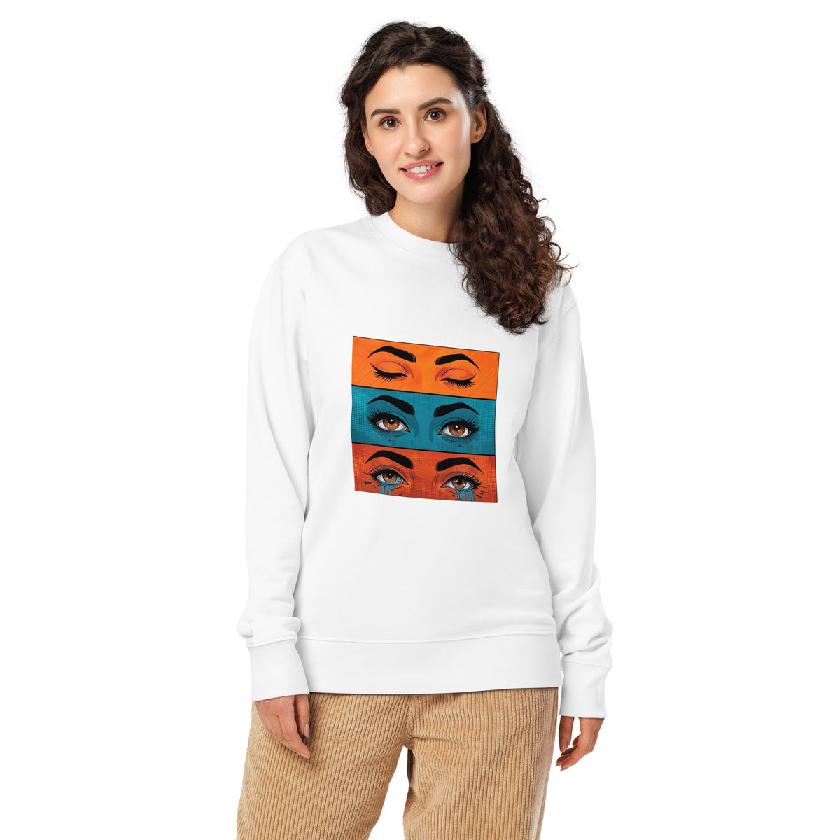 Woman wearing a white sweatshirt with colorful eye design on a white background