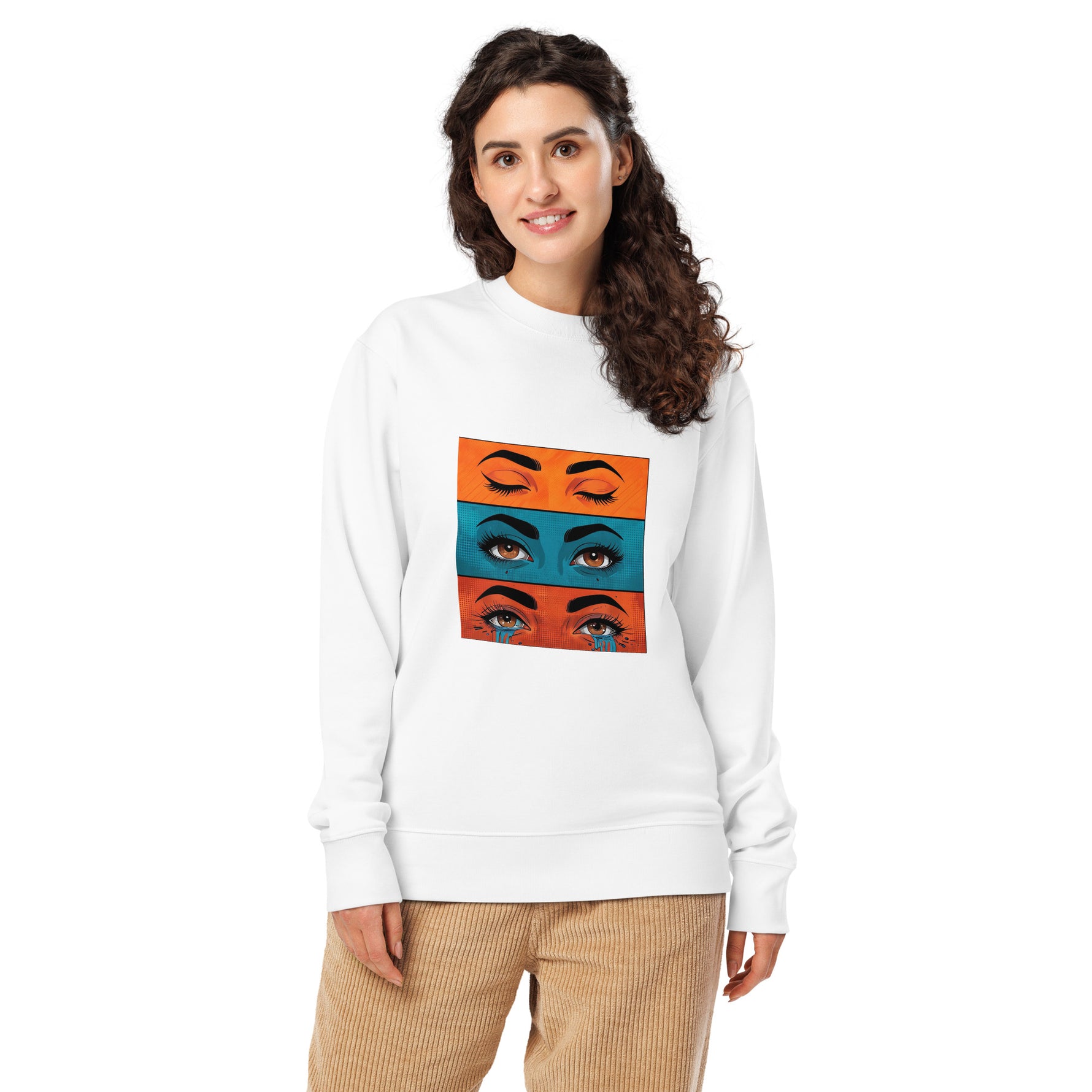 Woman wearing a white sweatshirt with colorful eye design on a white background