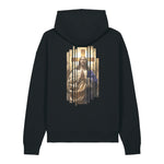 A black pullover hoodie shown from the back, featuring a large graphic print of Jesus Christ in a gold robe and blue cloak behind a cross.