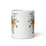 White mug with floral design on a white background