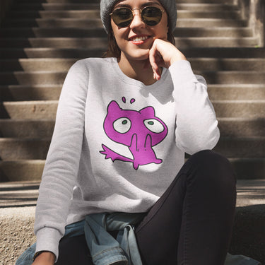 Person wearing a gray sweatshirt with a purple cartoon character on it, sitting on steps.