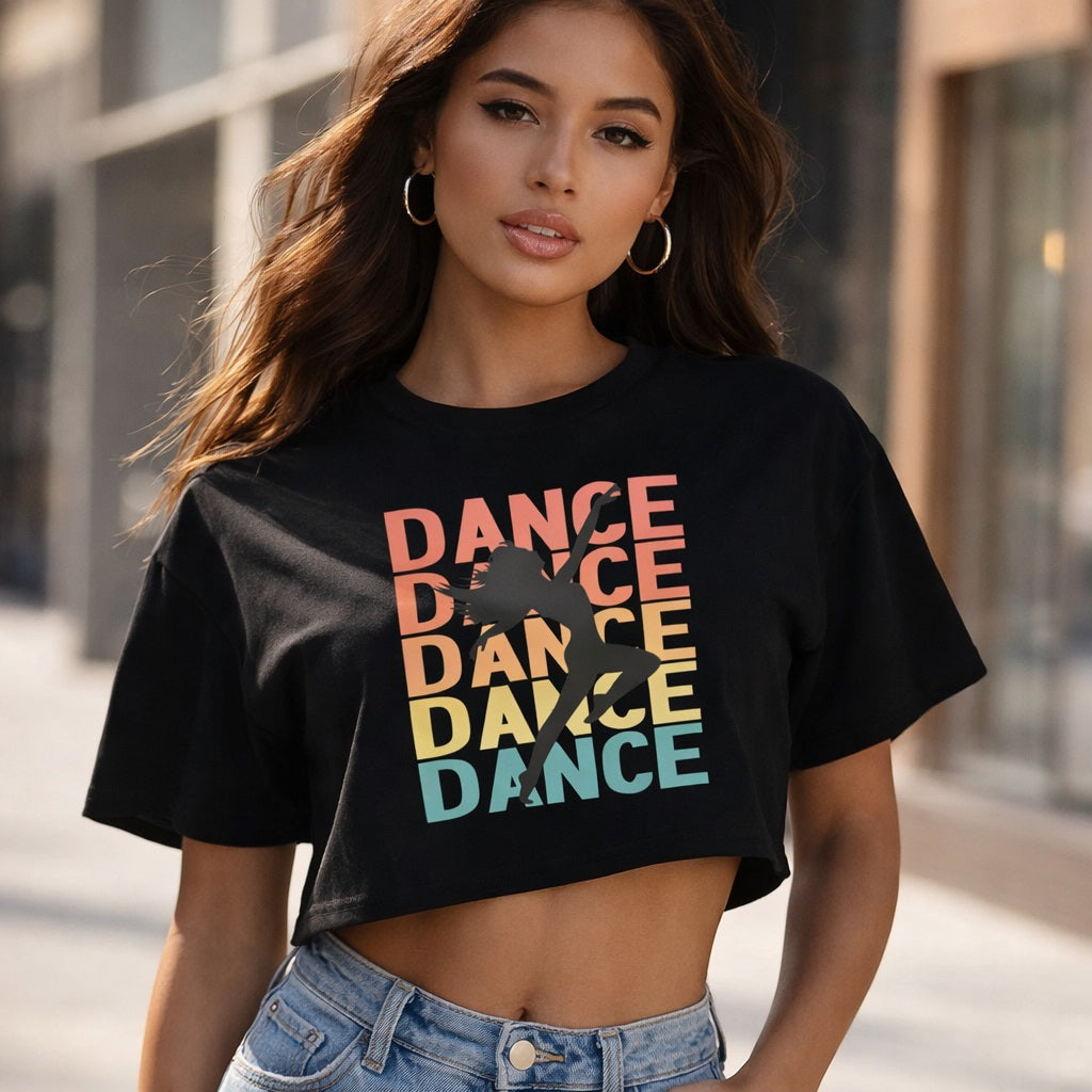 Woman wearing a black t-shirt with 'DANCE' graphic in colorful letters.