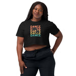 Woman wearing a black crop t-shirt with 'DANCE' text design on a white background