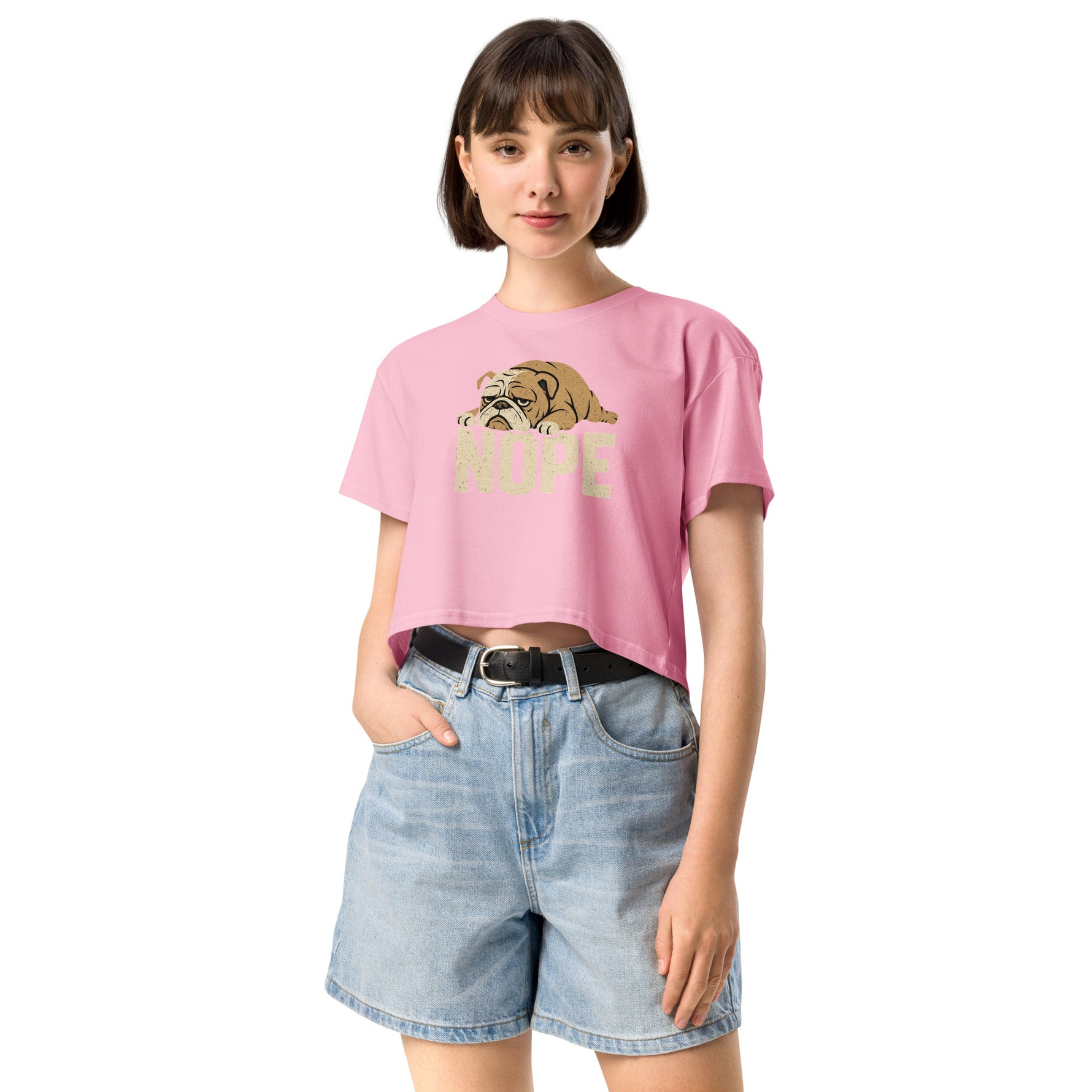 Woman wearing a pink t-shirt with a dog graphic and 'Hope' text, paired with denim shorts on a white background.