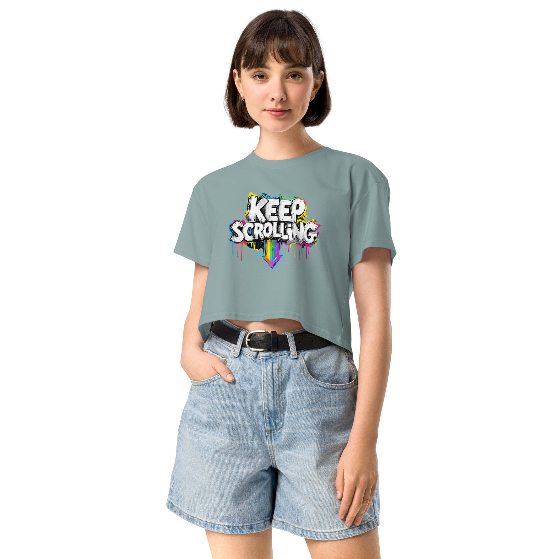 Woman wearing a light blue t-shirt with 'Keep Scrolling' text and denim shorts on a white background