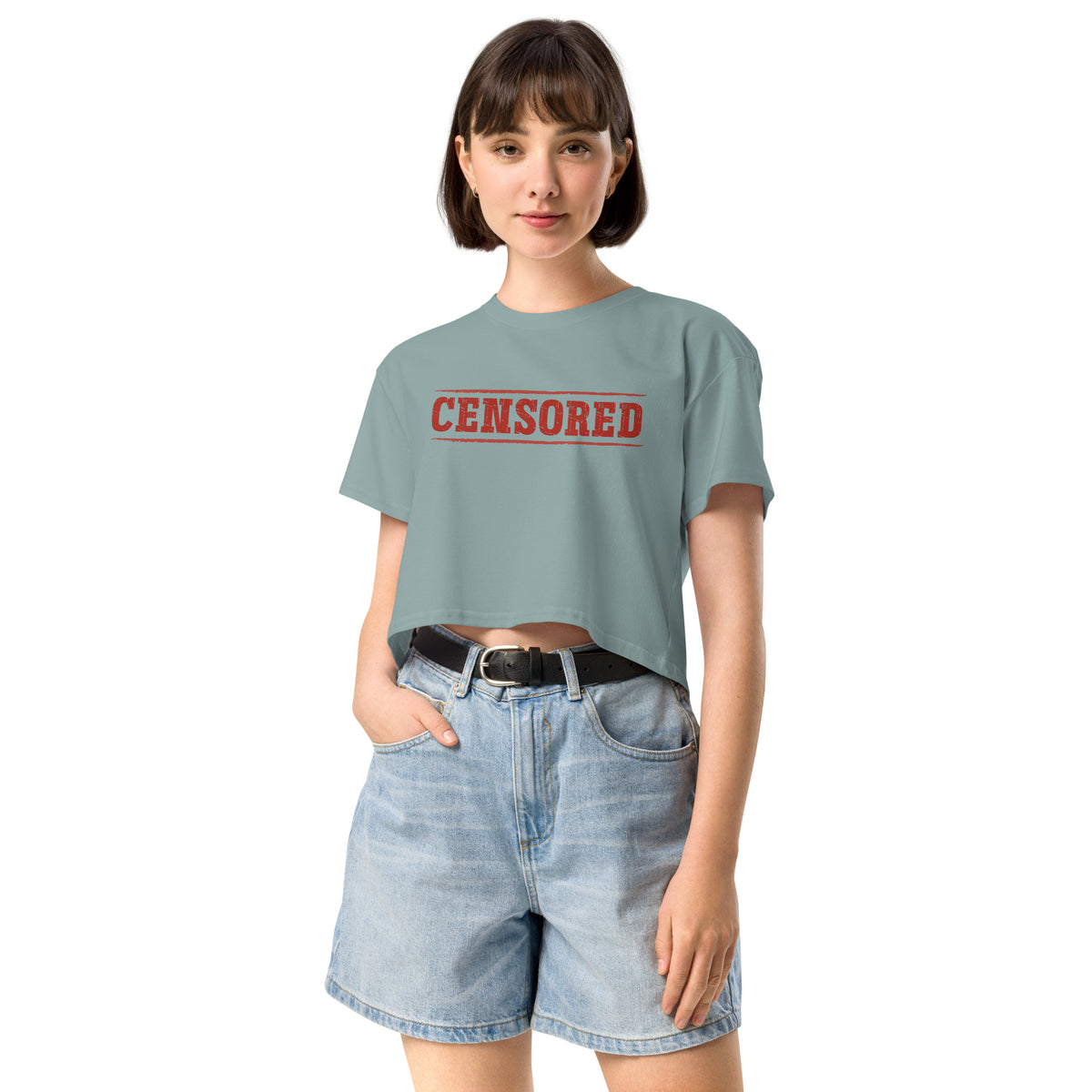 Woman wearing a light blue t-shirt with 'CENSORED' printed in red on a white background