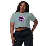 Woman wearing a crop top with a graphic design and text on a white background