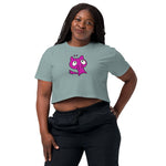 Woman wearing a light blue crop top with a pink cartoon character on a white background