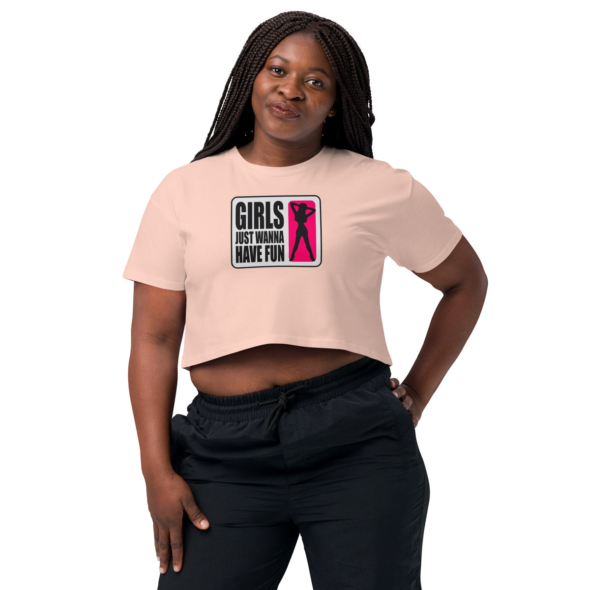 Woman wearing a beige crop t-shirt with a graphic design and text on a white background