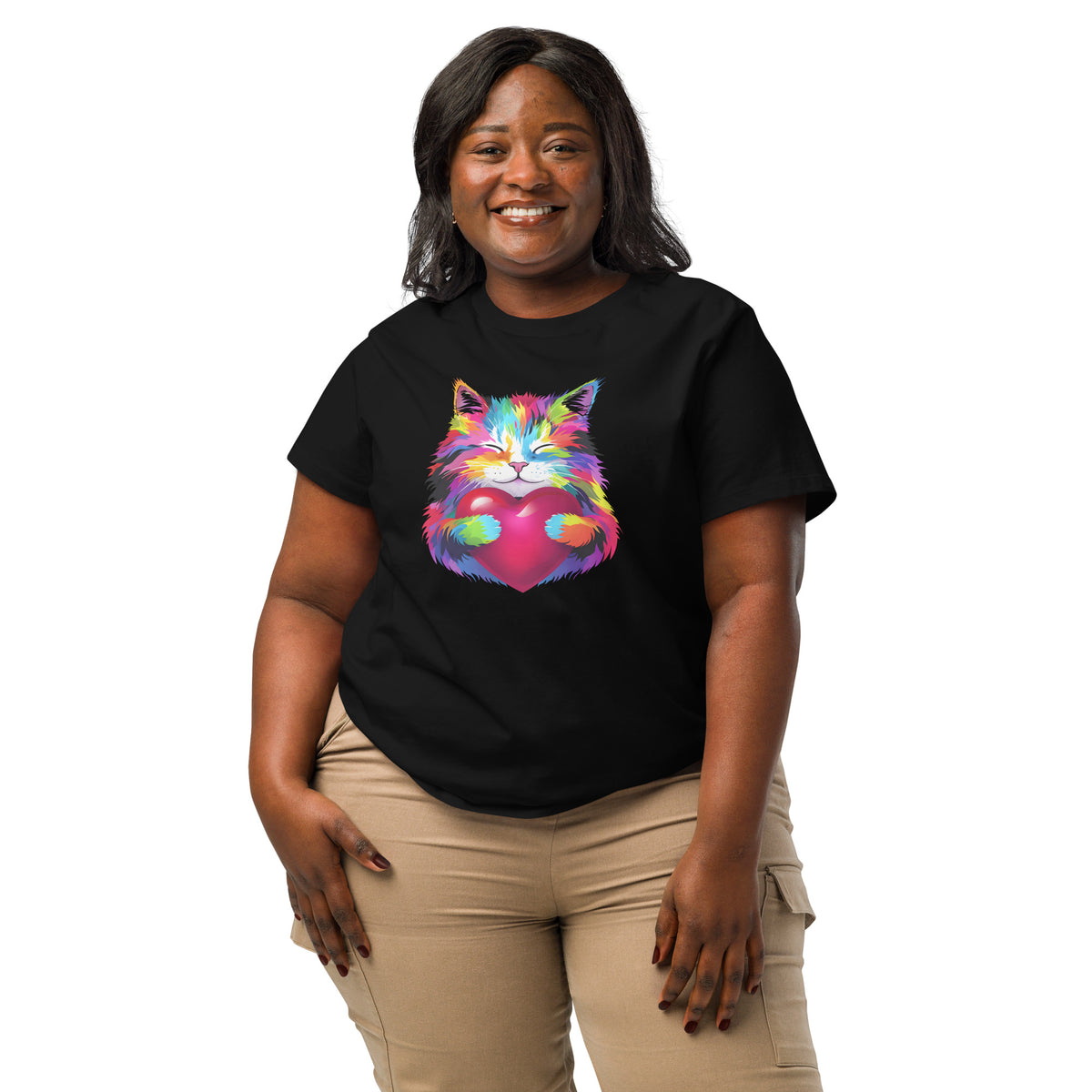 Woman wearing a stanley/stella black t-shirt with a colorful cat graphic on a white background
