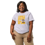 Woman wearing a stanley/stella  white t-shirt with yellow text and a graphic of a woman's face on a white background