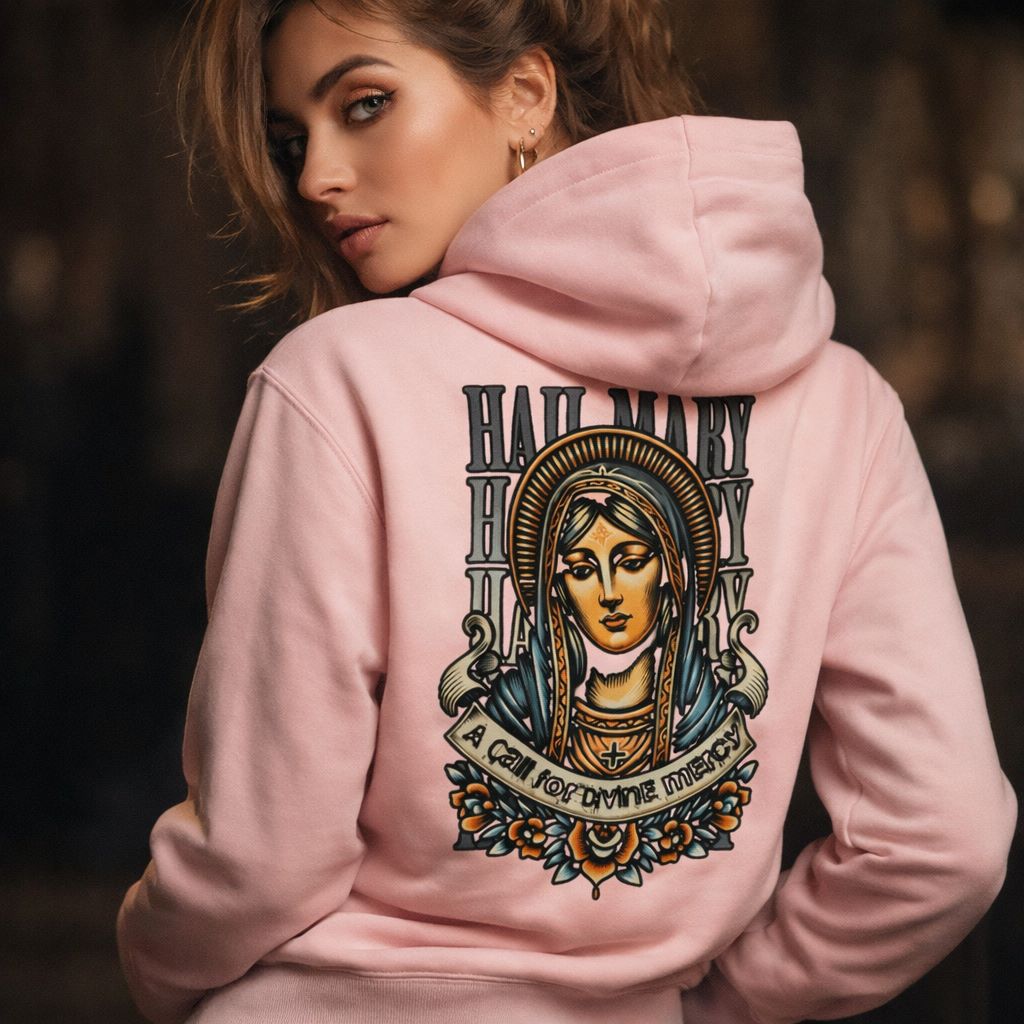 Woman wearing a pink hoodie with a religious design on the back