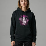 Woman wearing a black Stanley/Stella hoodie with a purple graphic design on a gray background