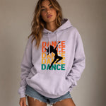 Woman wearing a light purple hoodie with 'DANCE' text and dancer graphic on a beige background
