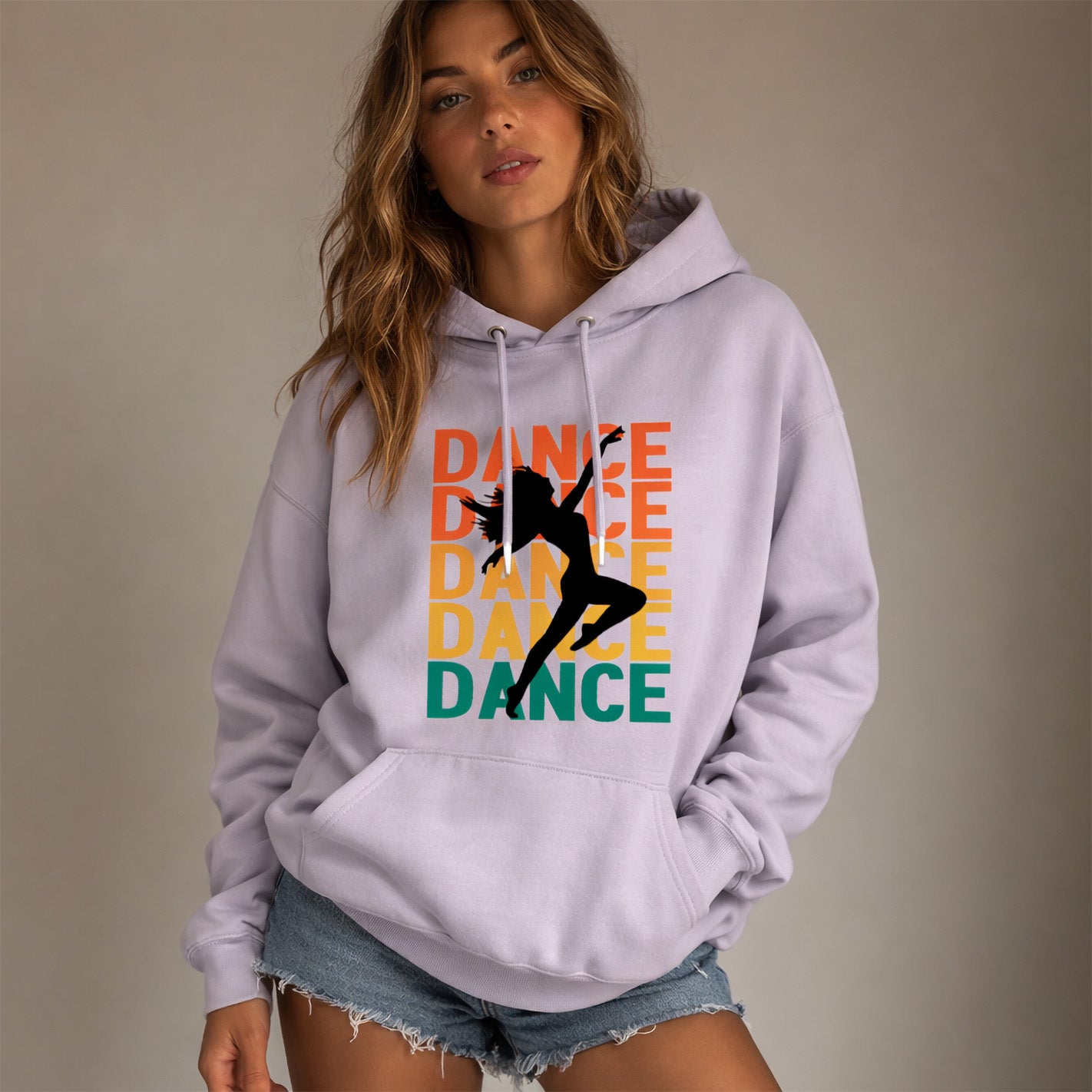 Woman wearing a light purple hoodie with 'DANCE' text and dancer graphic on a beige background