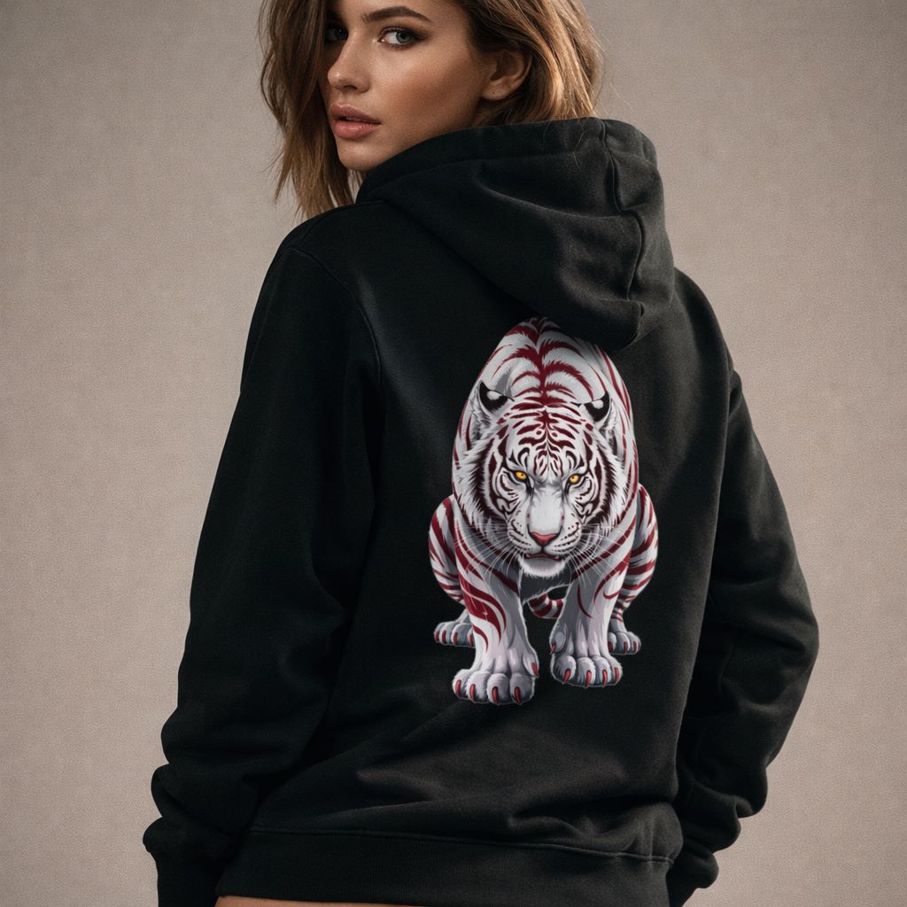 Women's wearing a black hoodie with a white tiger design on the back against a neutral background