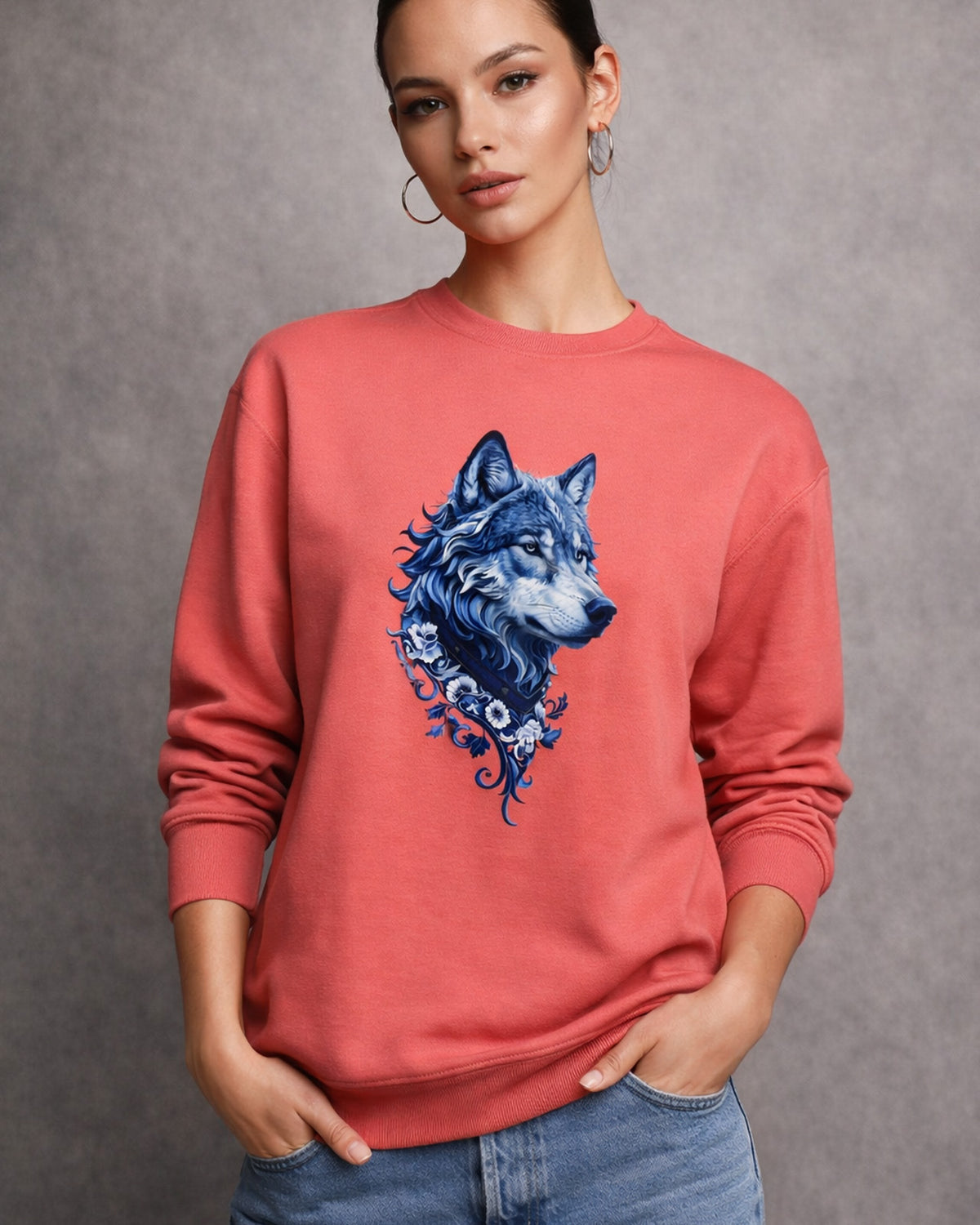 woman wearing a red sweatshirt with a blue wolf design on a gray background