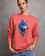 woman wearing a red sweatshirt with a blue wolf design on a gray background