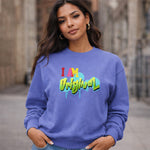 Woman wearing a blue sweatshirt with colorful text outdoors