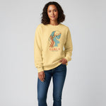 Woman wearing a yellow sweatshirt with a graphic design and text on a plain background