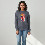 woman wearing a gray sweatshirt with a colorful graphic design on a plain background