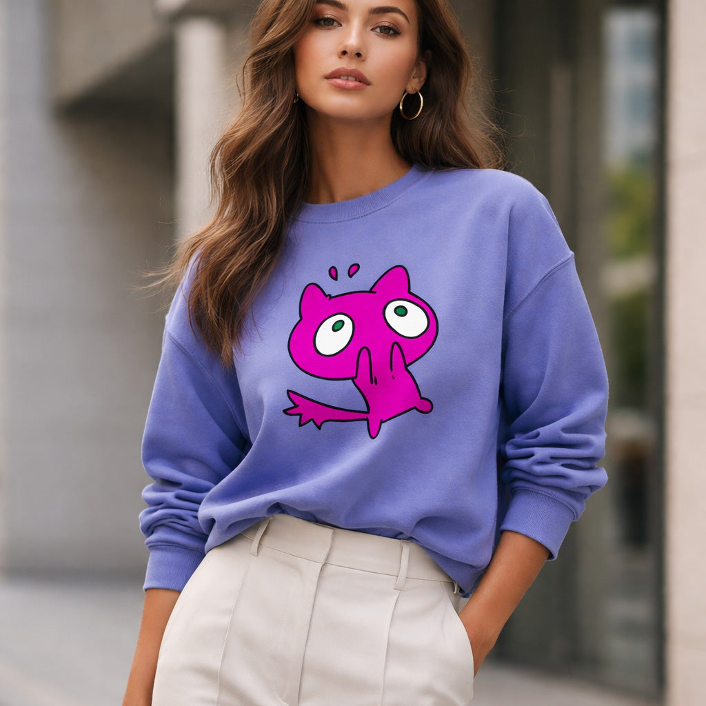 Woman wearing a purple sweatshirt with a pink cartoon character on a blurred street background