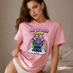 Woman wearing a pink t-shirt with a cartoon character and 'Devilishly Cute' text.
