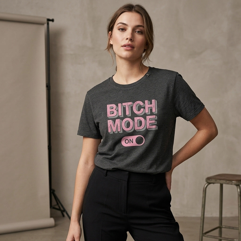 Woman wearing a dark gray t-shirt with 'BITCH MODE ON' in pink text against a neutral background.