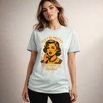Woman wearing a light blue t-shirt with a graphic design and text.