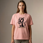 Model wearing a pink t-shirt with a black cat graphic and 'I am Lovely' text on a beige background