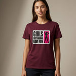 A woman wearing a maroon T-shirt with a graphic that reads "Girls Just Wanna Have Fun" and features a pink silhouette of a dancing woman. She stands against a neutral background, facing the camera.