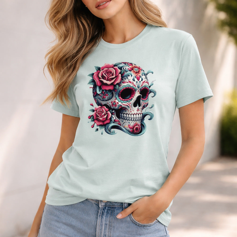Woman wearing a light blue t-shirt with a colorful skull and floral design.