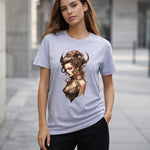 Woman wearing a t-shirt with an artistic design of a woman's face on a blurred street background