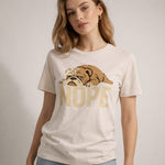 Woman wearing a t-shirt with a bulldog graphic and 'NOPE' text on a plain background