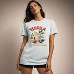 Woman wearing a light blue t-shirt with a tequila graphic and text on a beige background